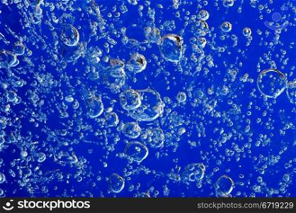 Air bubbles frozen in ice. Close-up