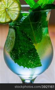 air bubbles in the mint leaves in the mojito cocktail