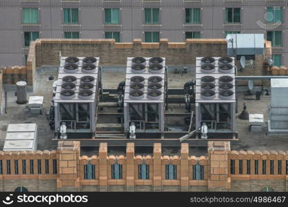 Air Conditioner ventilation system on building rooftop. Aerial view to AC system on skyscraper.