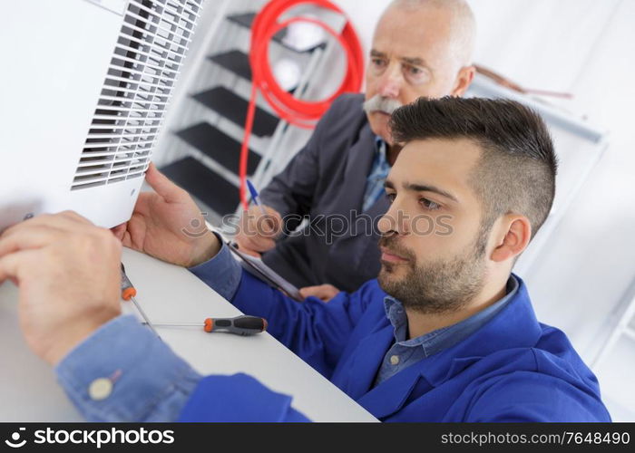 air conditioning technician at work