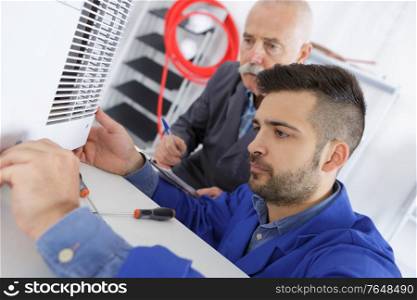 air conditioning technician at work