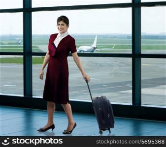 Air hostess with luggage