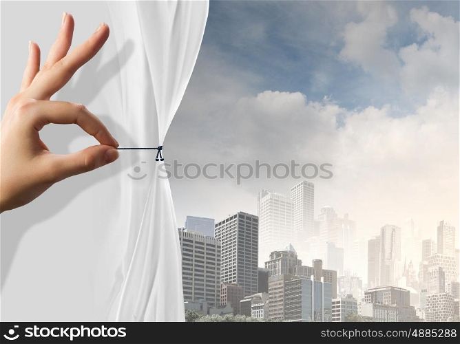 Air pollution. Close up of hand opening the white curtain