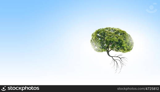 Air pollution. Conceptual image of green tree shaped like brain