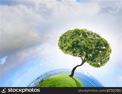 Air pollution. Conceptual image of green tree shaped like brain