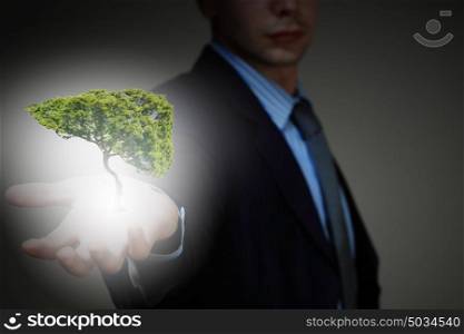 Air pollution. Conceptual image of green tree shaped like human liver