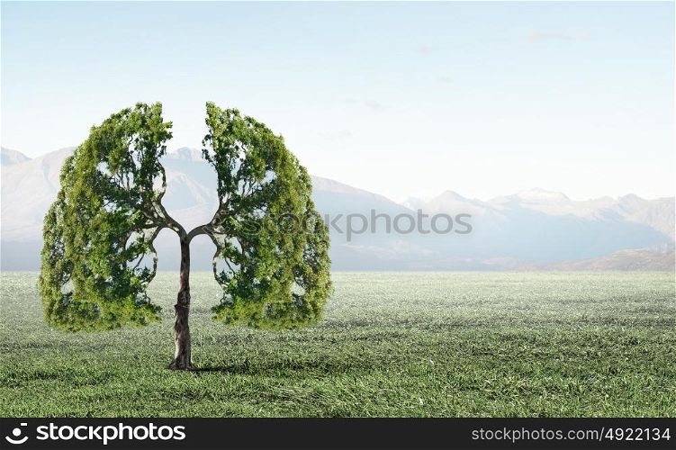Air pollution. Conceptual image of green tree shaped like human lungs