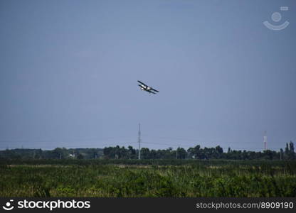 Aircraft agricultural aviation AN-2. The spraying of fertilizers and pesticides on the field with the aircraft.. The spraying of fertilizers and pesticides on the field with the aircraft.