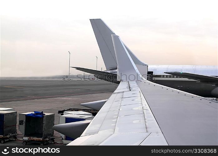 aircraft airplane landed wing perspective in airport