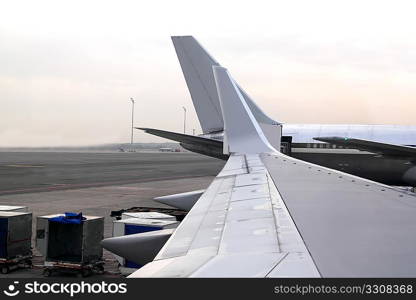 aircraft airplane landed wing perspective in airport