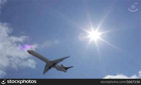 Aircraft in the sky. Sun rays.