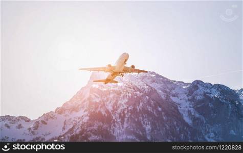 Aircraft is taking off, idyllic mountain range in the background