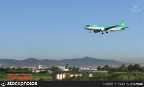 Aircraft landing at Barcelona Airport.Passenger airplane landing.Flying airplane approaching airstrip.