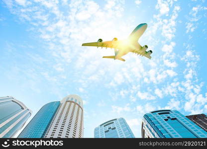 Airplane above city