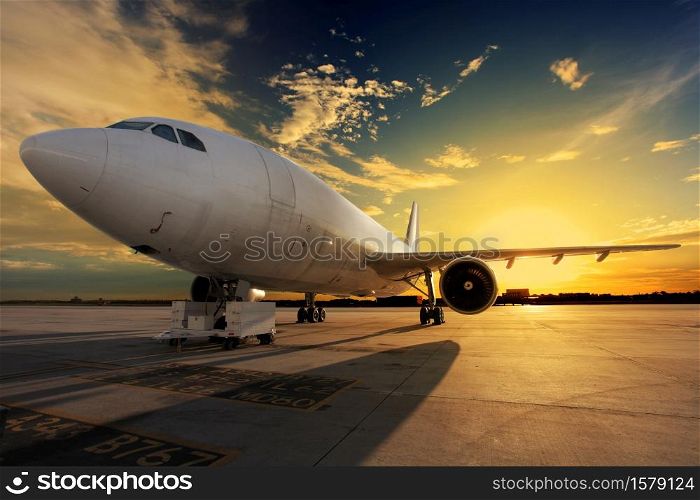 Airplane at sunset back lit