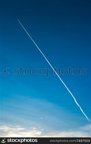 airplane contrail against clear blue sky