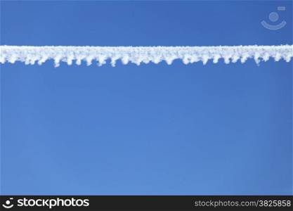 Airplane contrail in the deep blue sky