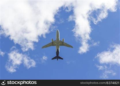 Airplane flies against a background of white cloud. Airplane flies against a background of white clouds