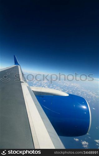 airplane fly in blue sky cloud around