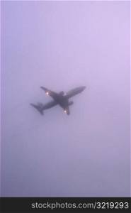 Airplane Flying in Cloudy Sky