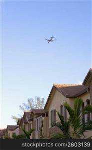 Airplane flying over neighborhood