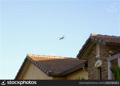 Airplane flying over neighborhood