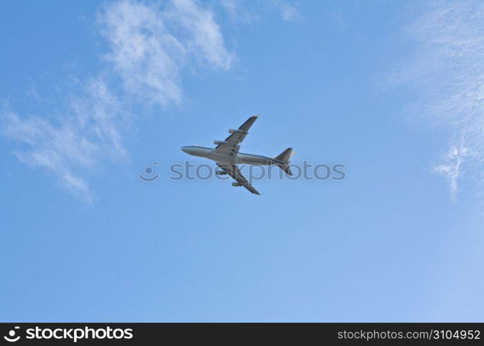 Airplane in sky, low angle view