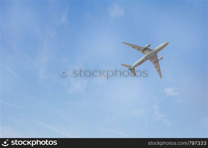 airplane in the blue sky background texture toy. airplane in the blue sky background texture