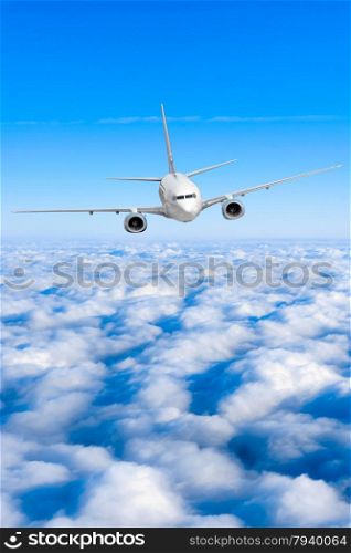 airplane in the sky. Passenger jet air plane flying on blue sky white clouds background