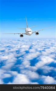 airplane in the sky. Passenger jet air plane flying on blue sky white clouds background