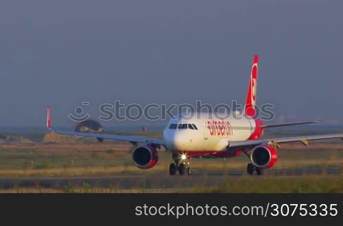 Airplane moving on the take-off strip and then making a turn. Airberlin is the second largest airline in Germany