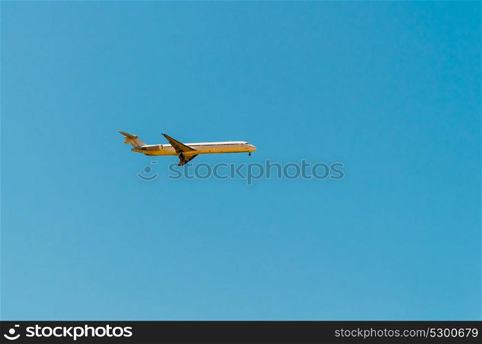 Airplane On Clear Blue Summer Sky