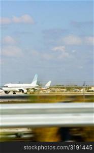 Airplane taking off at an airport runway, Miami, Florida, USA