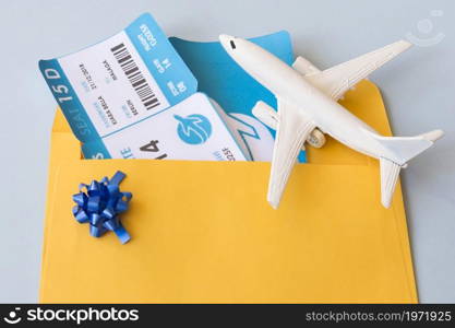 airplane tickets document case near toy aircraft. High resolution photo. airplane tickets document case near toy aircraft. High quality photo