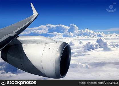 airplane wing aircraft turbine flying blue sky white clouds