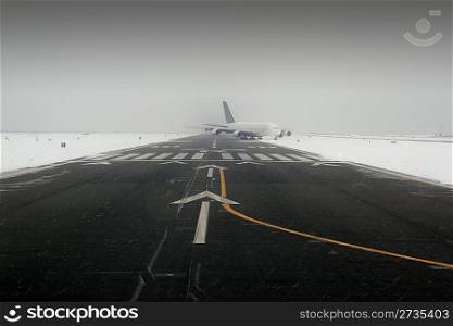 airplane wing aircraft turbine landing in snow winter runway