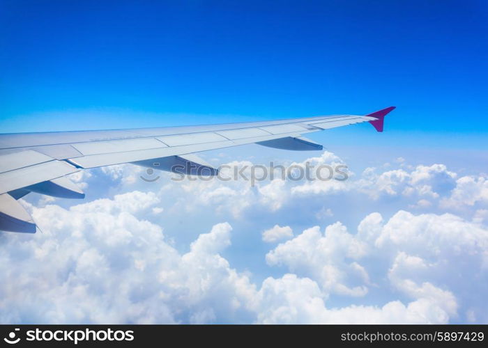 Airplane wing on the blue sky background