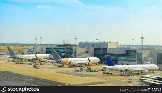 Airplanes at runway by the airport terminal, Frankfurt am Main, Germany