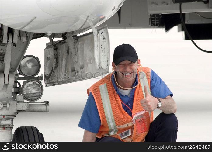 Airport ground crew smiling, portrait