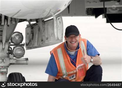 Airport ground crew smiling, portrait