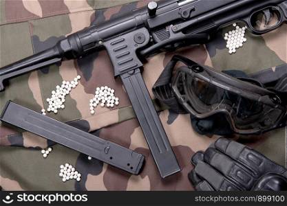 airsoft gun with the protective glasses and lot of bullets