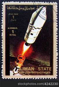 AJMAN - CIRCA 1973: a stamp printed in the Ajman shows Rocket in Space, Spaceflight Program, circa 1973