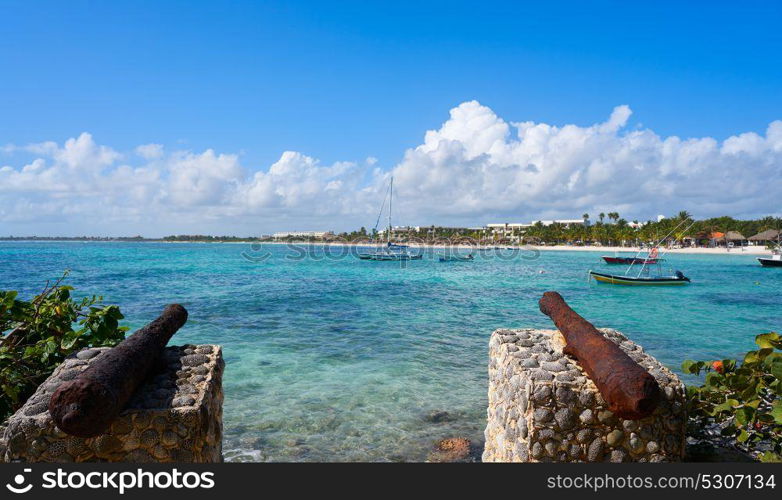 Akumal beach rusted iron canon in Riviera Maya of Mayan Mexico