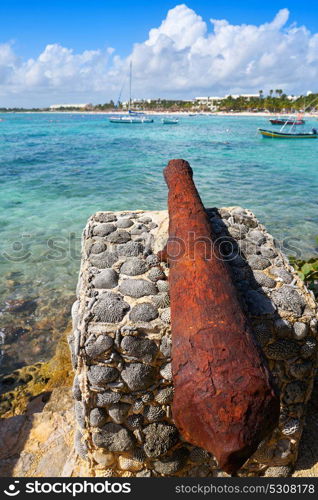 Akumal beach rusted iron canon in Riviera Maya of Mayan Mexico