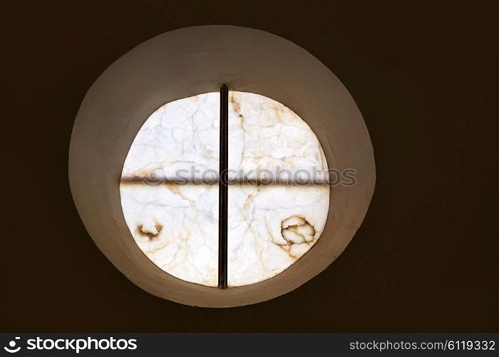 alabaster round window with cross difussed light for churches in Spain
