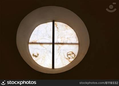 alabaster round window with cross difussed light for churches in Spain