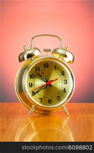 Alarm clock against colourful background