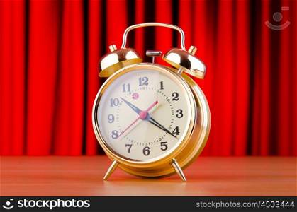 Alarm clock against curtain