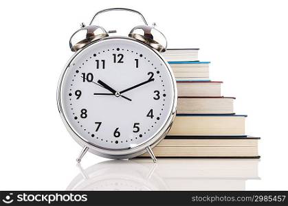 Alarm clock and books isolated on white