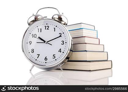 Alarm clock and books isolated on white